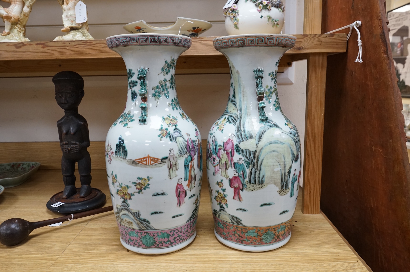 A pair of large late 19th century Chinese famille rose ‘scholars’ vases, 45cm high